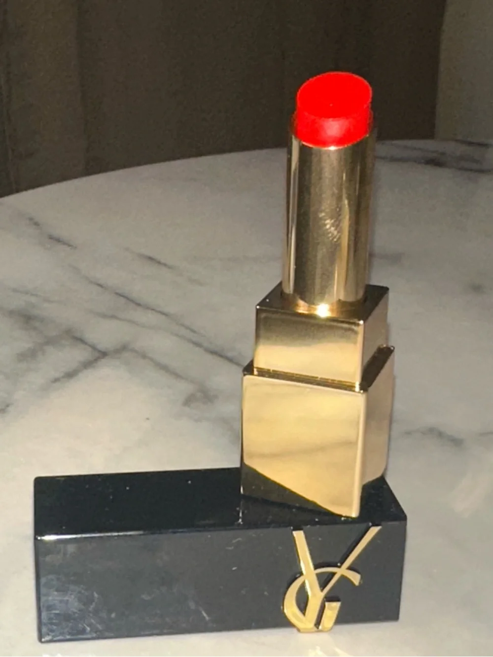 Yves Saint Laurent Gold & Black Tube Lipstick — Bright Red color “Wilful Red.”